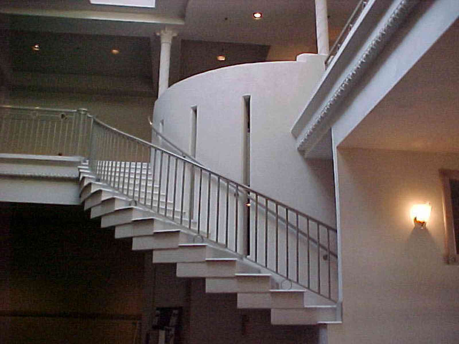 Pensacola:-Palafox-Historic-District:-Saenger-Theatre_03e.jpg:  movie lobby, movie theatre, curving staircase