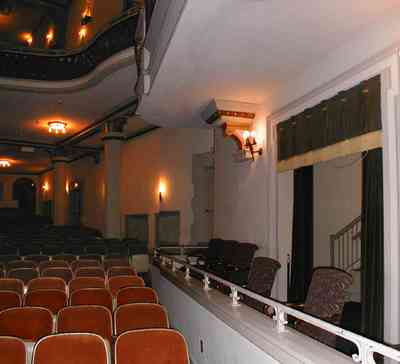 Pensacola:-Palafox-Historic-District:-Saenger-Theatre_05b.jpg:  theatre, balcony, box seating, velvet seats, stage, fringed curtains, stairs, opera house, philharmonic symphony orchestra, baroque architecture