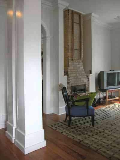 Pensacola:-Seville-Historic-District:-202-Cevallos-Street_09a.jpg:  heart pine floors, fireplace, central hall, living room