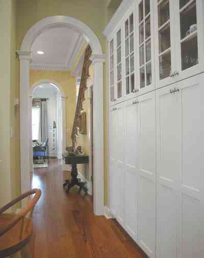 Pensacola:-Seville-Historic-District:-202-Cevallos-Street_13.jpg:  cabinets, heart pine floors, staircase, dining room, kitchen, columns, arcade, arched doorway