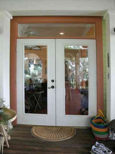 Pensacola:-Seville-Historic-District:-202-Cevallos-Street_23.jpg:  back porch, wooden deck, floor mat, glass doors, transom, victorian cottage