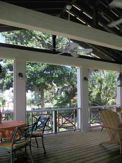 Pensacola:-Seville-Historic-District:-202-Cevallos-Street_25.jpg:  back porch, wooden deck, palm trees, patio, deck, screened porch, victorian cottage