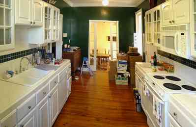 Pensacola:-Seville-Historic-District:-211-Cevallos-Street_04.jpg:  gallery kitchen, historic home, hardwood floors, dinign room, cevallos street