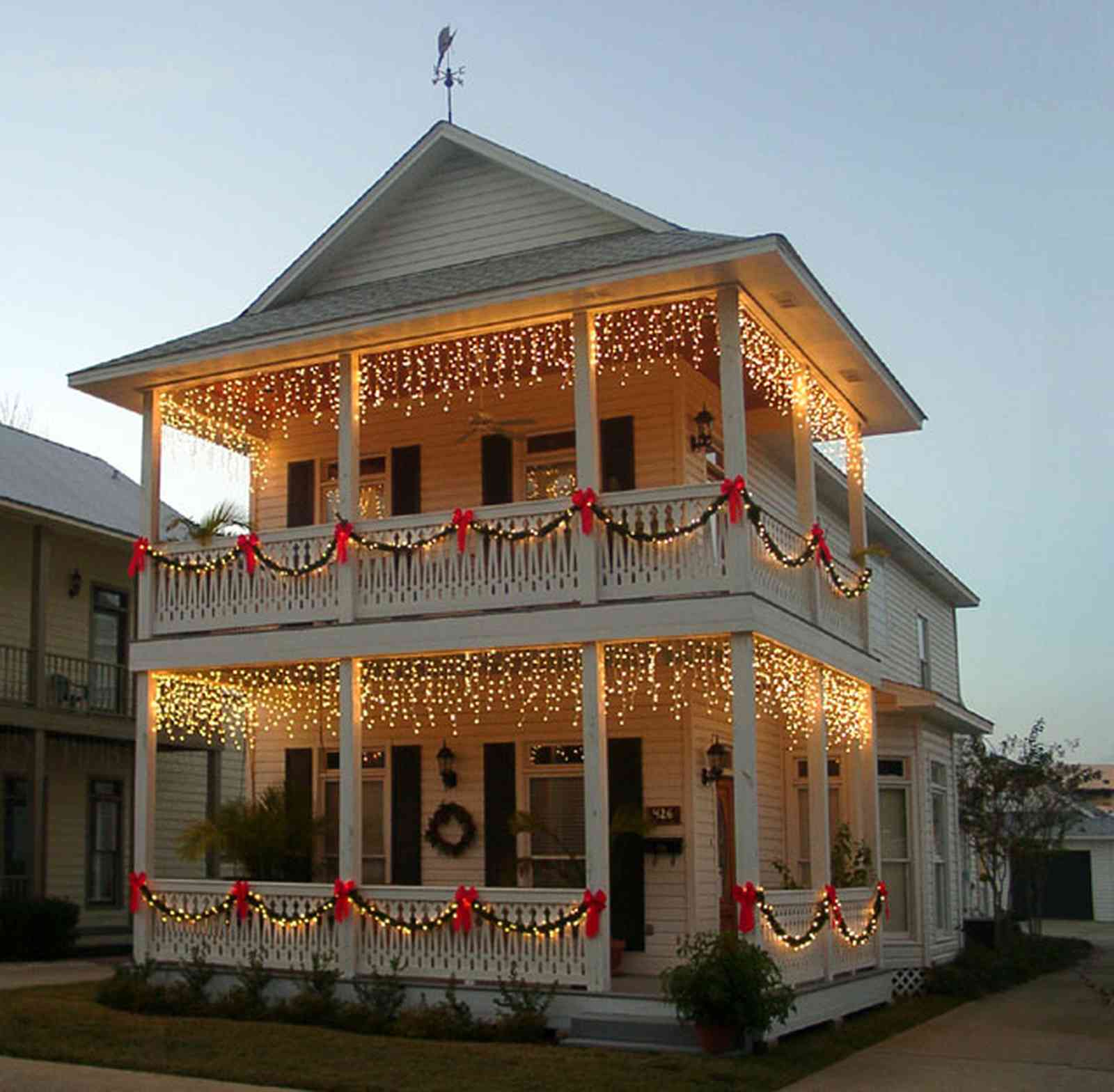 Pensacola:-Seville-Historic-District:-426-East-Intendencia-Street_02.jpg:  christmas decorations, bows, garland, wreath, victorian shotgun cottage, weather vane