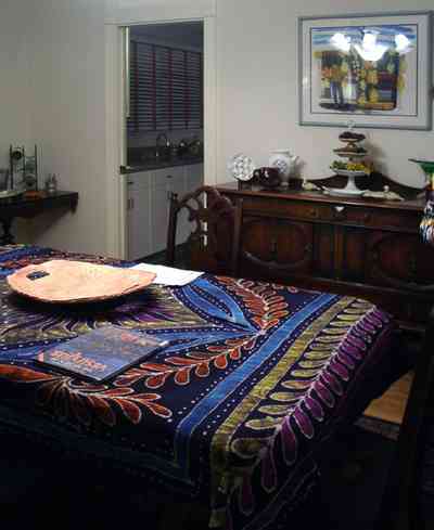 Pensacola:-Seville-Historic-District:-529-East-Government-Street_17.jpg:  dining room, buffet, batik tablecloth, chandelier