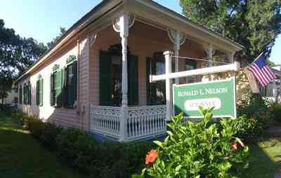 Pensacola:-Seville-Historic-District:-Ronald-L.-Nelson,-Attorney_01.jpg:  american flag, office, victorian home, shutters