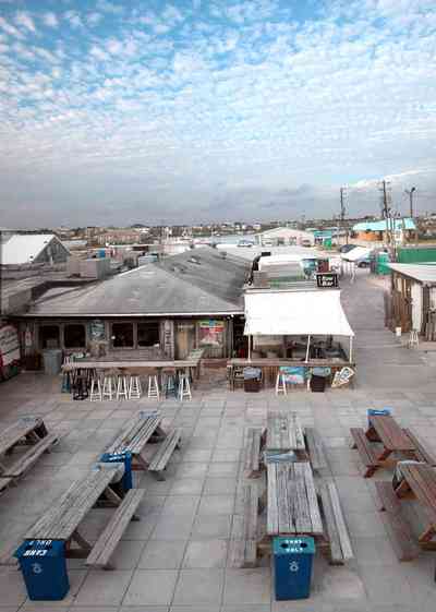 Perdido-Key:-Flora-Bama-Lounge_02a.jpg:  bar, lounge, mullet toss, picnic tables, tent