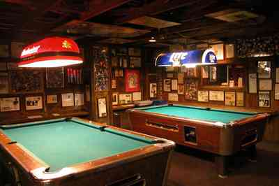 Perdido-Key:-Flora-Bama-Lounge_05.jpg:  pool tables, bar, lounge, mementos, photographs