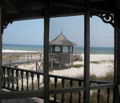 Perdido-Key:-Gothic-House_08b.jpg:  porch, screen porch, summer house, gazebo, cedar shake roof, walkway, pier, deck, gulf of mexico, emerald water, dunes, sea oats, beach