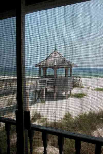 Perdido-Key:-Gothic-House_08d.jpg:  porch, screen porch, summer house, gazebo, cedar shake roof, walkway, pier, deck, gulf of mexico, emerald water, dunes, sea oats, beach