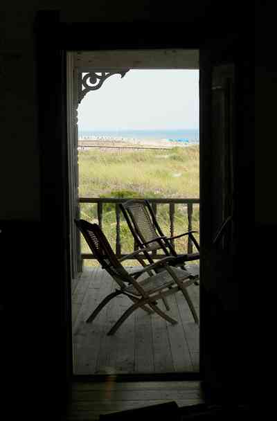 Perdido-Key:-Gothic-House_08f.jpg:  porch, screen porch, summer house, gazebo, cedar shake roof, walkway, pier, deck, gulf of mexico, emerald water, dunes, sea oats, beach, deck chairs, doorway