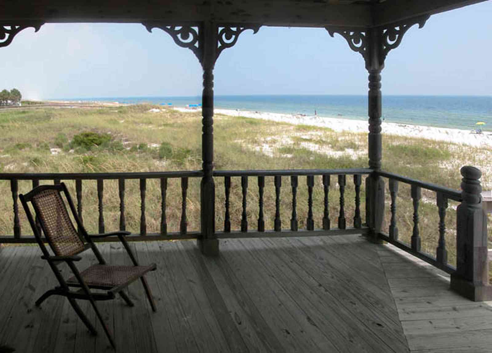 Perdido-Key:-Gothic-House_08g.jpg:  porch, deck, deck chairs, gothic architecture, dunes, white sand, gulf of mexico, perdido key, escambia county, weathered wood, rough wood, newel post