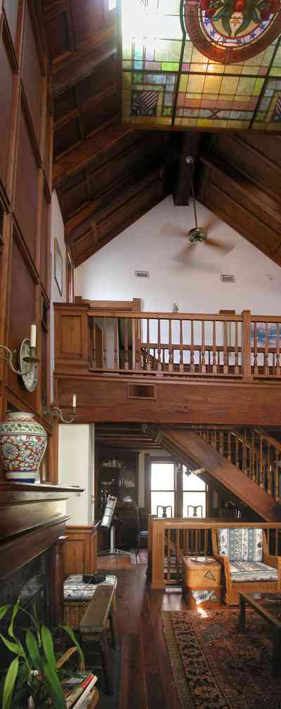 Perdido-Key:-Gothic-House_08jj.jpg:  great room, wooden floors, heartpine, oriental rug, gothic architecture, candle sconce, dining room, living room