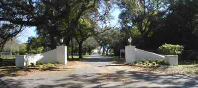 Sanders-Beach:-Pensacola-Yacht-Club_00.jpg:  sailing boats, white brick pillars, lantersn, oak trees, spanish moss