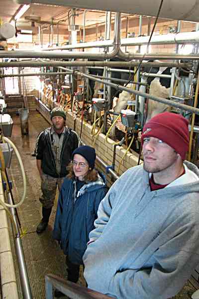 Walnut-Hill:-VanPelt-Farm_10.jpg:  dairy farm, heifer barn, milking barn, corral, fence, farmer, holstein cows, milking machines, farmland